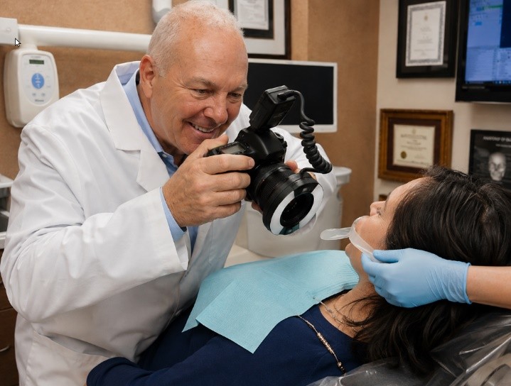 Dr. Maxson using a digital camera chairside